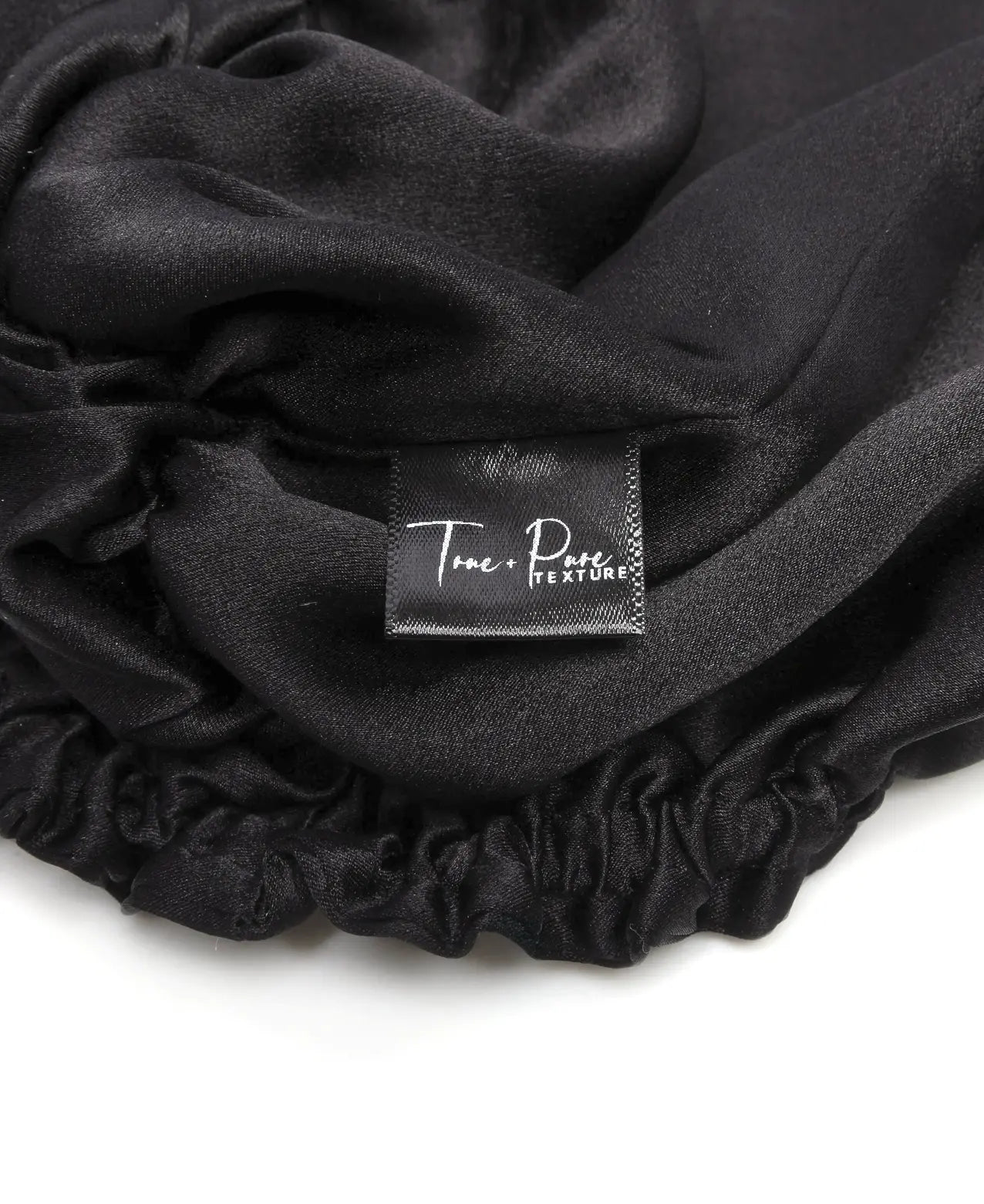 Satin hair turban designed for natural hair care, anti-frizz protection, and overnight moisture retention—ideal hair wrap for sleeping, preventing breakage, and preserving curly hairstyles.