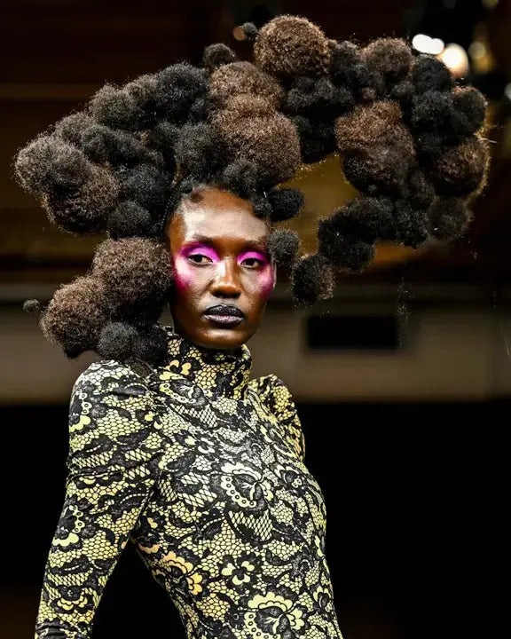 Model wearing True + Pure Texture Extensions Jasmine Coil Afro Kinky Curly Texture as braids at Black Hair Reimagined Hair Show Pre-Met Gala Event