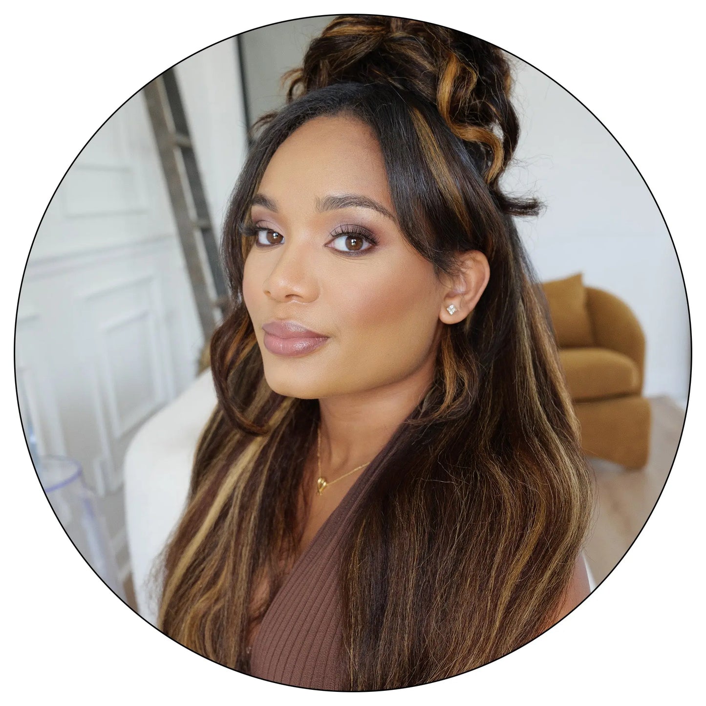 rue and Pure Texture woman wearing Brown Blonde 27/4 relaxed natural kinky straight hair extensions with highlighted blonde streaks and closure inset