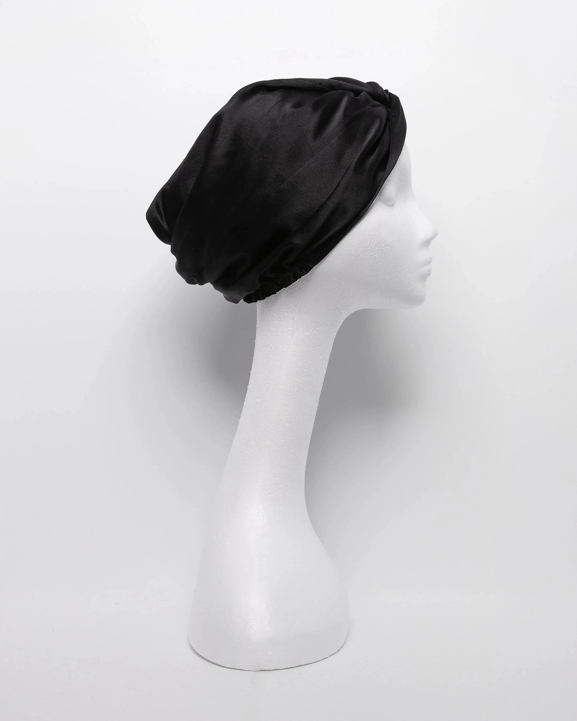 Satin hair turban designed for natural hair care, anti-frizz protection, and overnight moisture retention—ideal hair wrap for sleeping, preventing breakage, and preserving curly hairstyles.