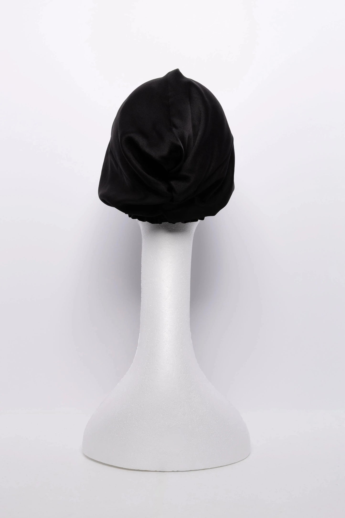 Satin hair turban designed for natural hair care, anti-frizz protection, and overnight moisture retention—ideal hair wrap for sleeping, preventing breakage, and preserving curly hairstyles.